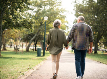 Rearview shot of a senior couple going for a walk in the park